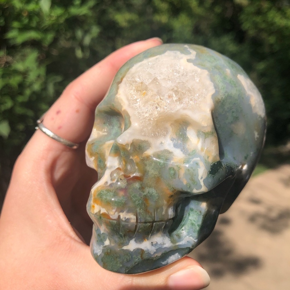 Moss agate skull carving
